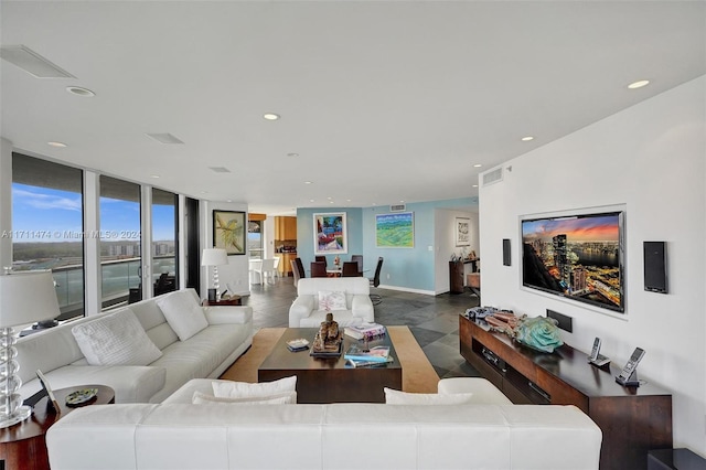 living room featuring a wall of windows