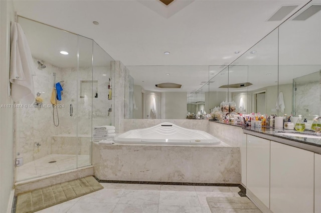 bathroom featuring separate shower and tub and vanity