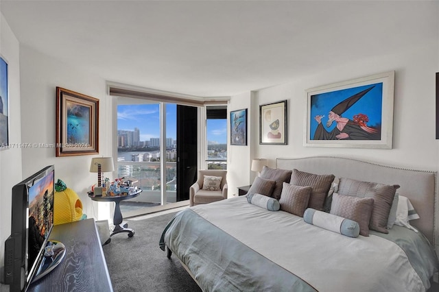 bedroom featuring carpet flooring and access to outside