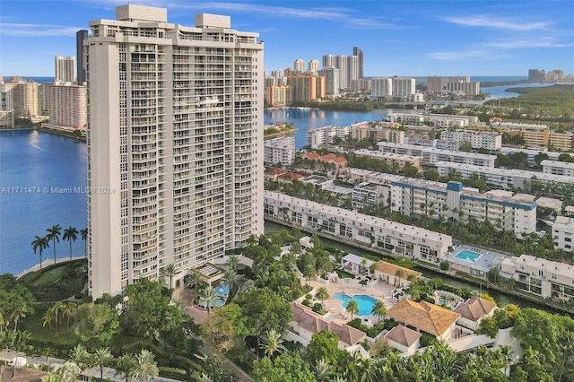 birds eye view of property with a water view