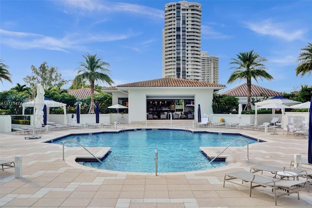 view of swimming pool with a gazebo and a patio