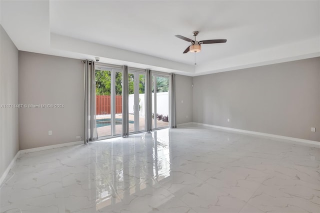 unfurnished room with ceiling fan