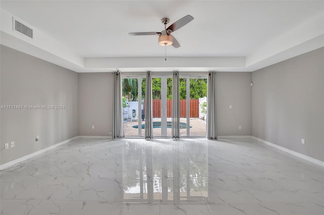 spare room with ceiling fan