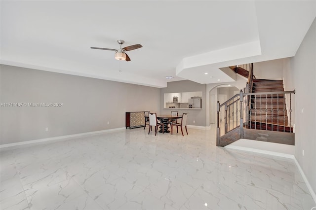 interior space featuring ceiling fan