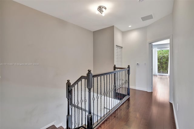 corridor with dark hardwood / wood-style floors