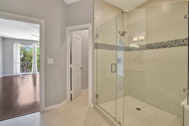 bathroom featuring hardwood / wood-style floors and walk in shower