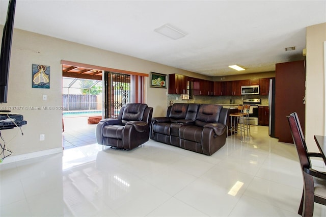 living area with light tile patterned flooring