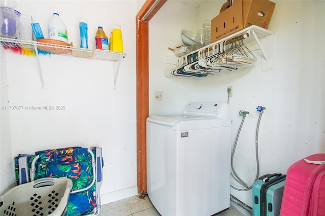 washroom featuring light tile patterned floors and washer / dryer