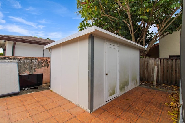 view of shed with fence