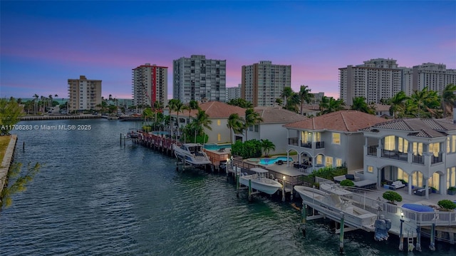 water view featuring a view of city, a dock, and boat lift