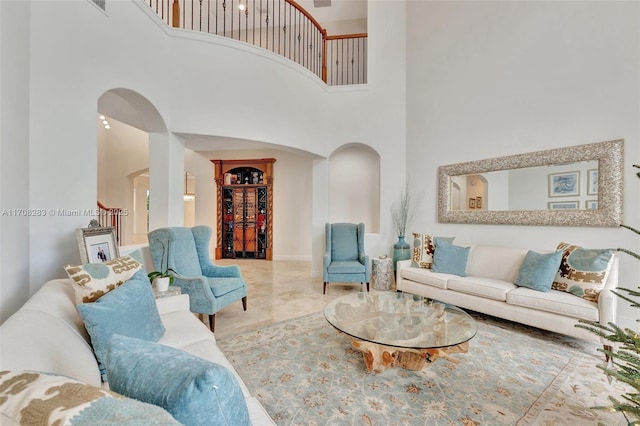 living room with a high ceiling