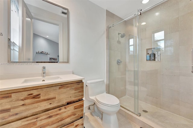 full bathroom featuring a stall shower, visible vents, toilet, tile patterned flooring, and vanity