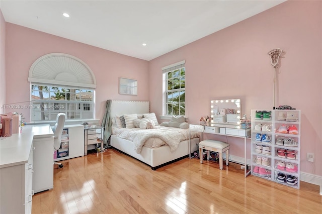 bedroom with recessed lighting and light wood finished floors