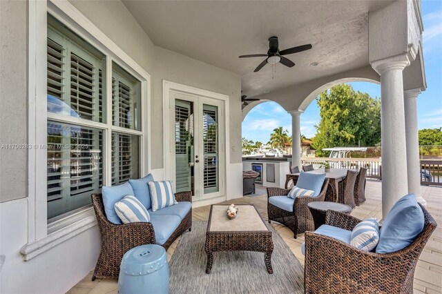 view of patio featuring outdoor lounge area, ceiling fan, and french doors