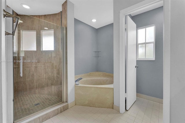 bathroom featuring tile patterned floors and plus walk in shower