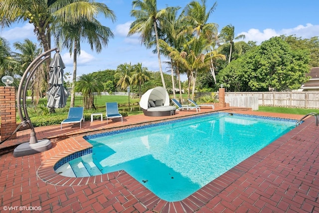 view of swimming pool with a patio area