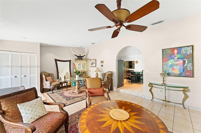 living room featuring ceiling fan and light tile patterned flooring