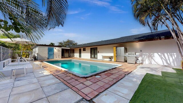 view of pool with a patio area