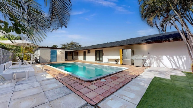 16313 SW 99th Pl, Miami, FL 33157 - outdoor pool with a patio area and fence