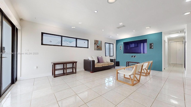 living room with light tile patterned floors