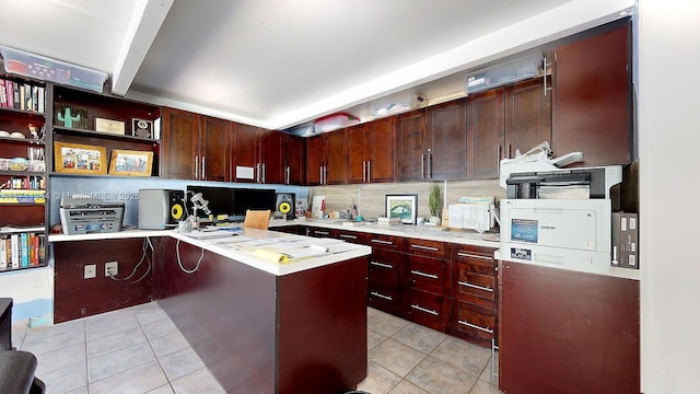 kitchen with beam ceiling, kitchen peninsula, decorative backsplash, a breakfast bar area, and light tile patterned floors