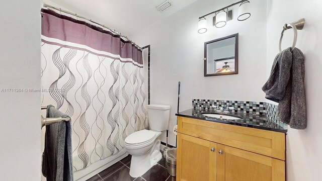 16313 SW 99th Pl, Miami, FL 33157 - bathroom featuring tile patterned flooring, visible vents, toilet, decorative backsplash, and vanity