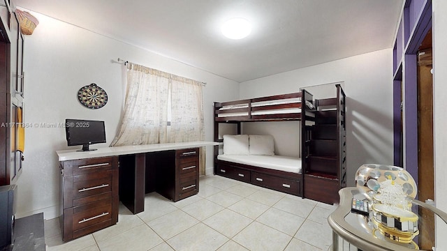 bedroom featuring light tile patterned floors