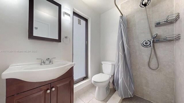 bathroom with toilet, a shower with shower curtain, tile patterned flooring, and vanity