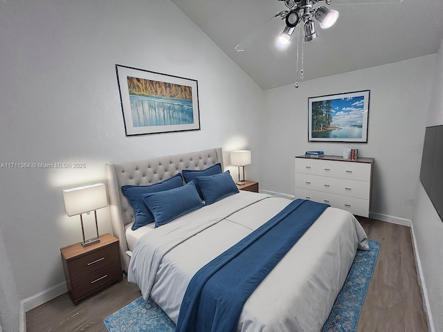 bedroom featuring wood-type flooring and vaulted ceiling