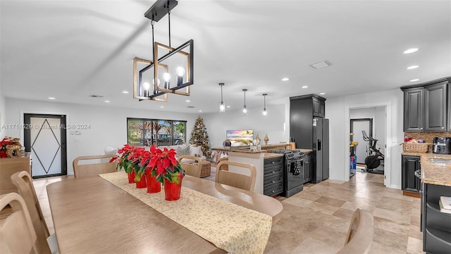 dining area featuring a notable chandelier