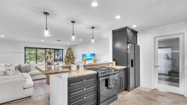 kitchen with stainless steel appliances, light stone counters, kitchen peninsula, decorative light fixtures, and a breakfast bar