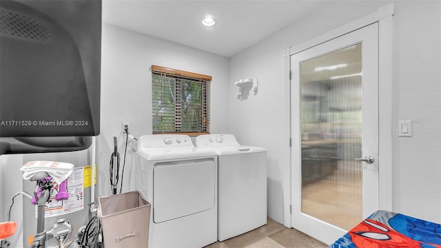 washroom featuring washer and clothes dryer