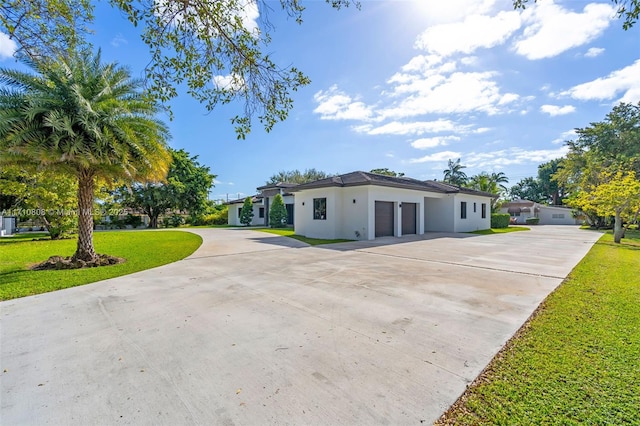 view of side of home with a garage and a lawn