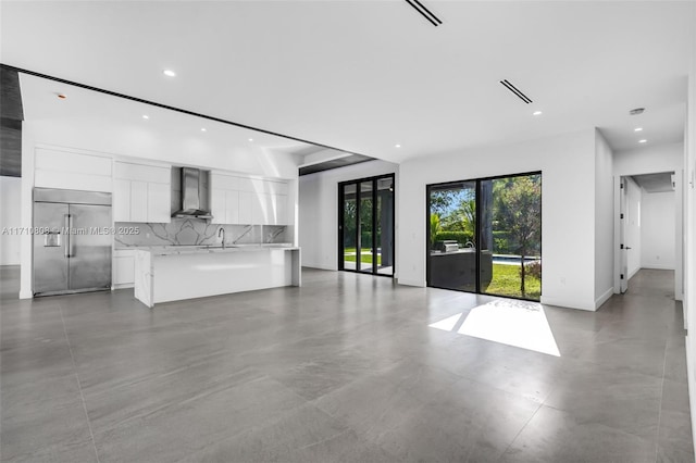 unfurnished living room with sink