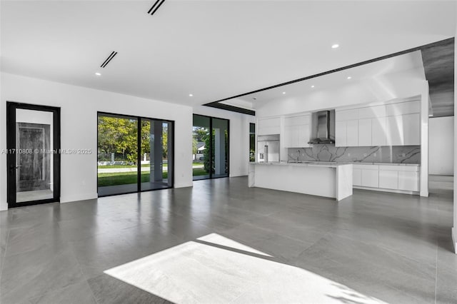 unfurnished living room with sink