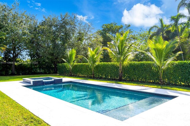 view of swimming pool featuring an in ground hot tub