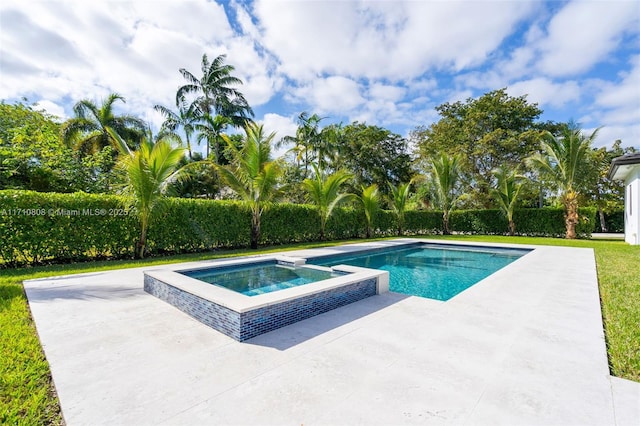 view of pool with an in ground hot tub and a patio