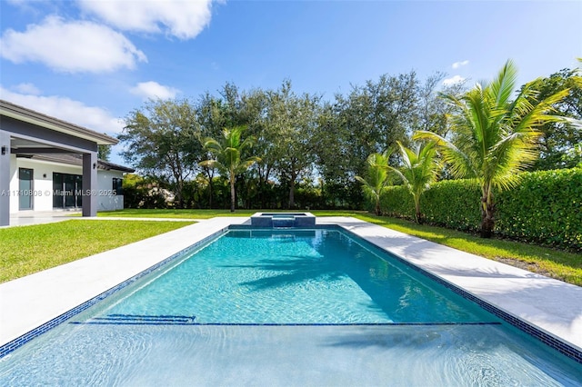 view of swimming pool featuring an in ground hot tub and a yard