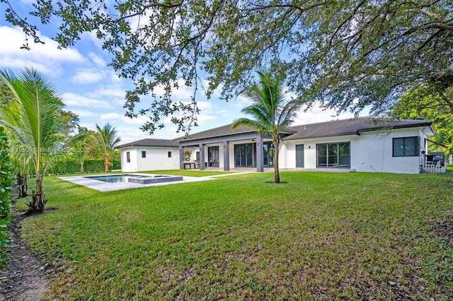 back of house featuring a lawn