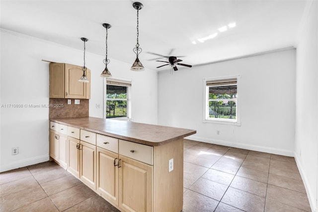 kitchen featuring a wealth of natural light, kitchen peninsula, decorative backsplash, and light brown cabinets