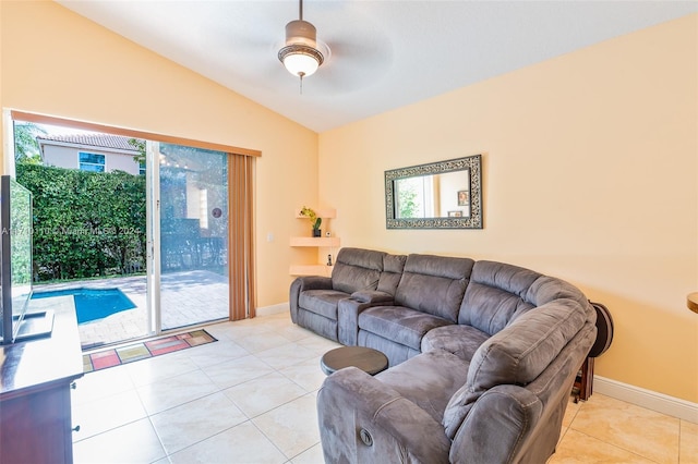 tiled living room featuring a wealth of natural light, lofted ceiling, and ceiling fan