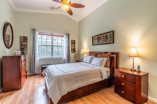 bedroom with ceiling fan, light hardwood / wood-style floors, lofted ceiling, and ornamental molding