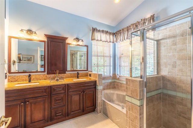 bathroom with vanity, tile patterned flooring, plus walk in shower, and lofted ceiling