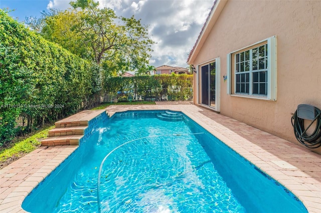 view of pool featuring pool water feature