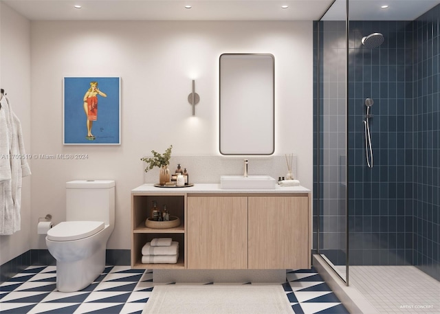 bathroom with tiled shower, vanity, toilet, and tile patterned flooring