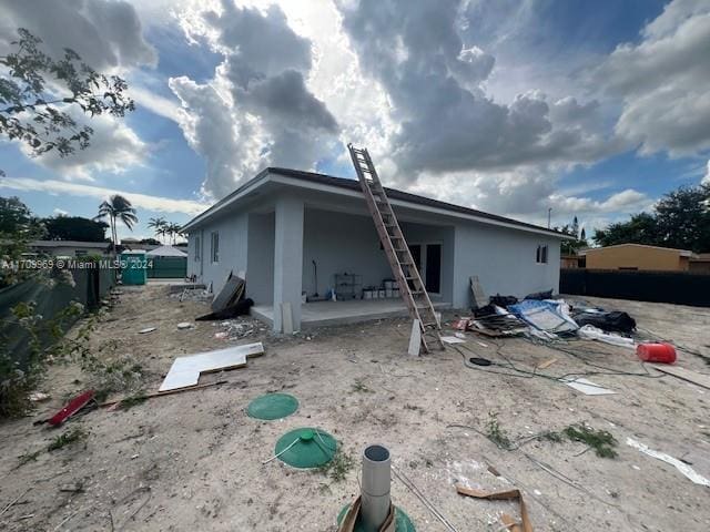 back of house with a patio area