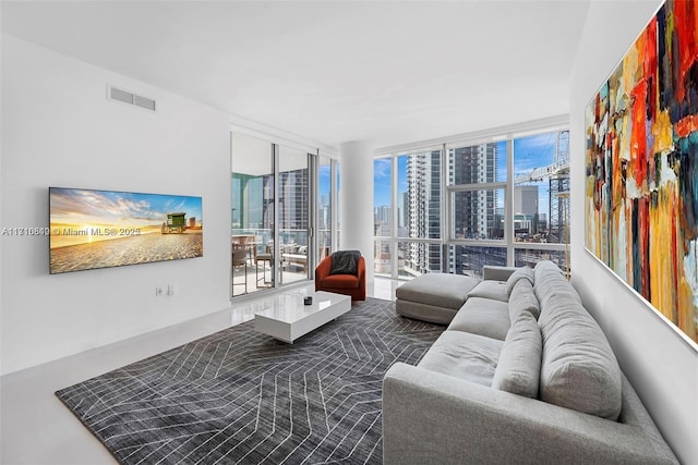 living room featuring a wall of windows