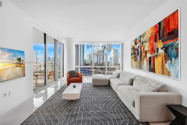 living room featuring floor to ceiling windows