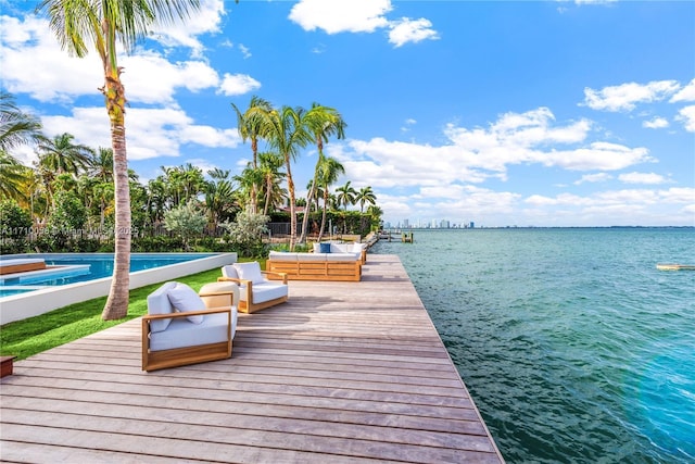 view of dock with a water view and an outdoor hangout area