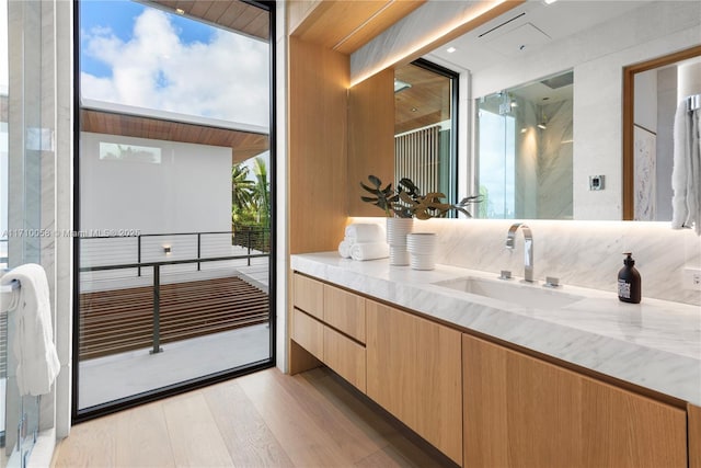 bathroom with vanity and wood-type flooring